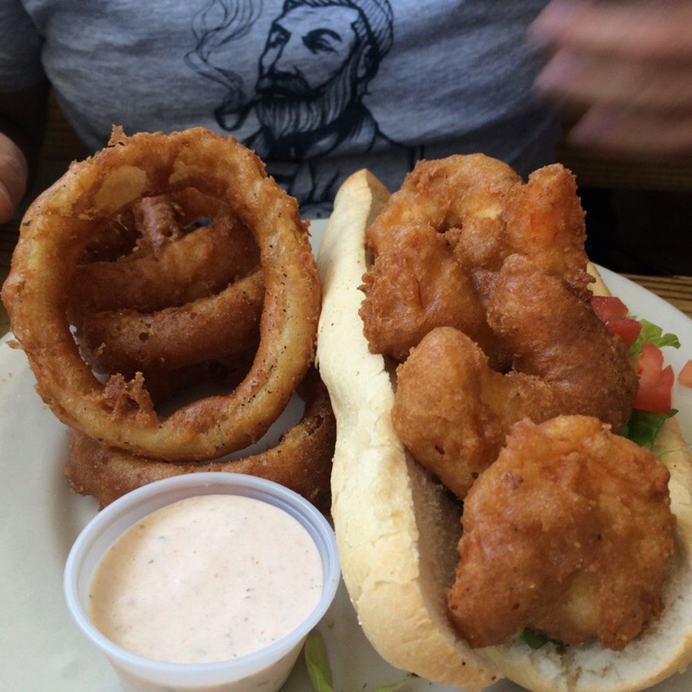Turtle Shack - Shrimp po boy with onion rings - Seafood Near Me - Palm Coast, Florida Turtle Shack - Shrimp po boy with onion rings - Seafood Near Me - Palm Coast, Florida
