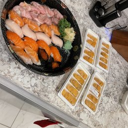 a variety of sushi on a table a variety of sushi on a table