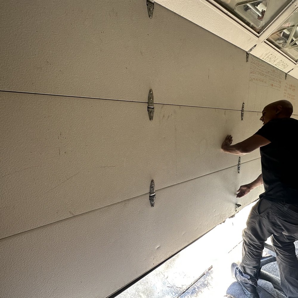 Oakland Garage Doors - Tom performing test on door to make sure all operation are within specifications - Garage Door Services Near Me - Oakland, California Oakland Garage Doors - Tom performing test on door to make sure all operation are within specifications - Garage Door Services Near Me - Oakland, California