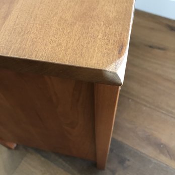 Clutter - Crush damage to nightstand - Self Storage Near Me