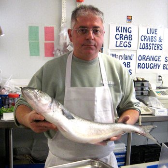 Courthouse Fish Market - Eddie holding a fish at Courthouse Fish Market - Seafood Markets Near Me - Cambridge, Massachusetts Courthouse Fish Market - Eddie holding a fish at Courthouse Fish Market - Seafood Markets Near Me - Cambridge, Massachusetts