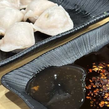 Dumpling King - Boiled shrimp, pork and chive dumplings with a plate of sauces. Ok. - Dim Sum Near Me - Coral Springs, Florida