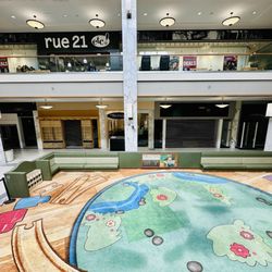 Open area and vacant stores on bottom floor
