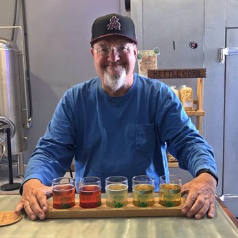 Tapped Apple Hard Cider - Old man having cider flight - Breweries Near Me - Salida, California