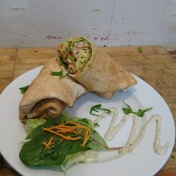 Spice Up Your Life - Chicken wrap with succulent marinated chicken, crunchy iceberg lettuce, chopped carrots, onions and drizzled with homemade mint sauce.