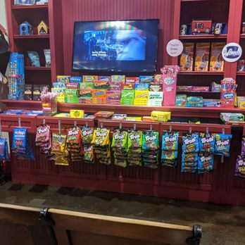 Zoonie's Candy - Willy Wonka playing on the television. People can sit in the chairs and watch the movie. - Candy Stores Near Me - Lafayette, California