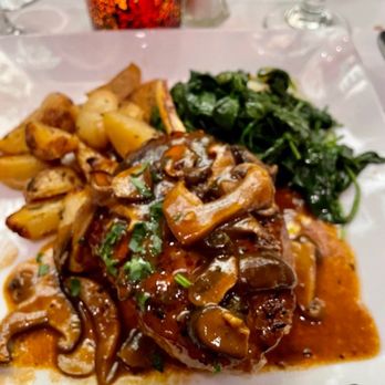 Il Corso - Grilled veal chop with mushrooms and spinach - Italian Near Me - Palm Desert, California Il Corso - Grilled veal chop with mushrooms and spinach - Italian Near Me - Palm Desert, California