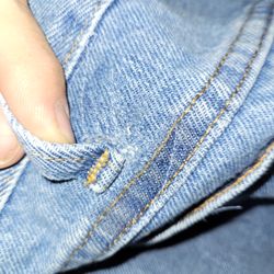 Alterations Unlimited - Belt loop stitched back on nice and strong.