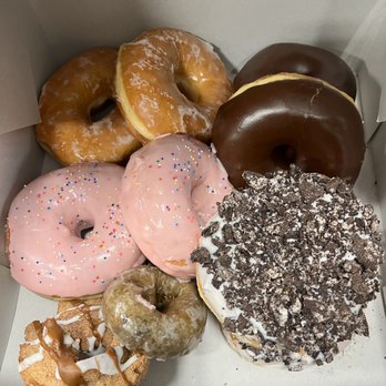 Voodoo Doughnut - (2) orders of 713 box in this pic. They shorted me a blueberry and churro donut in each box. - Donuts Near Me - Houston, Texas Voodoo Doughnut - (2) orders of 713 box in this pic. They shorted me a blueberry and churro donut in each box. - Donuts Near Me - Houston, Texas