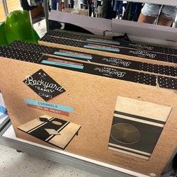 TJ Maxx - Cornhole had a pretty good price. About $35. We purchased it and it's not super heavy duty but it does the trick.
