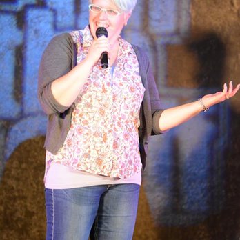 Off the Cuff Comedy Improvisation - a woman singing into a microphone - Performing Arts Near Me - Cedar City, Utah Off the Cuff Comedy Improvisation - a woman singing into a microphone - Performing Arts Near Me - Cedar City, Utah