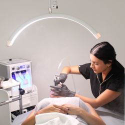 Glanz Aesthetics - Our Aesthetician, performing a DiamondGlow Facial.