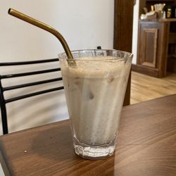 Good Ground Coffee Company - Iced chai latte with a metal straw!