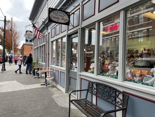 Photo of Elevated Ice Cream & Candy Shop - Port Townsend, WA, US. a bench outside