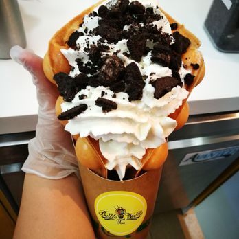 Bubble Waffle and Tea - a person holding a cup of ice cream - Bubble Tea Near Me - Sugar Land, Texas Bubble Waffle and Tea - a person holding a cup of ice cream - Bubble Tea Near Me - Sugar Land, Texas