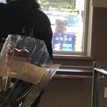 ALDI - a woman holding a bouquet of flowers - Grocery Near Me - Overland Park, Kansas