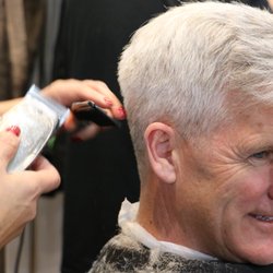 Hinsdale Barber Shop - Slyvia cutting another satisfied customer.