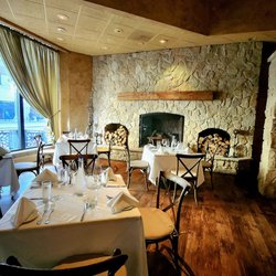 Cibreo Italian Kitchen - Romantic seating near the fireplace and front window view.