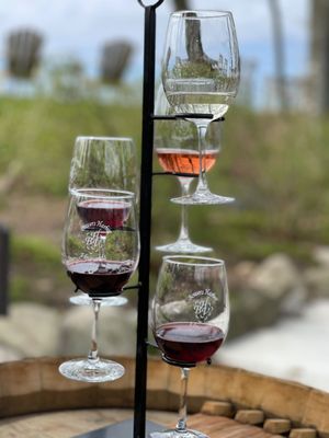 Photo of Bowers Harbor Vineyards - Traverse City, MI, US. three wine glasses on a wine barrel