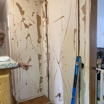 Chris Mejia Builder - a man standing in a room that is being remodeled - General Contractors Near Me Chris Mejia Builder - a man standing in a room that is being remodeled - General Contractors Near Me