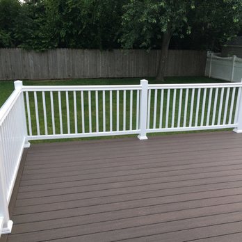 NCI Home Improvement - a deck with white railings - General Contractors Near Me NCI Home Improvement - a deck with white railings - General Contractors Near Me
