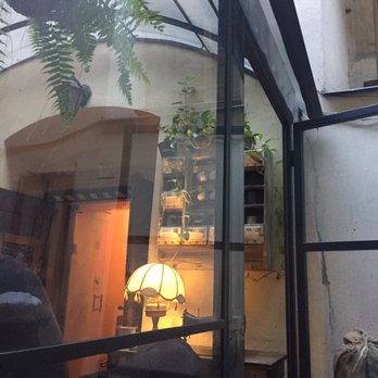 Cafe Magia - View of the greenhouse with eclectic decor - Cafes Near Me - Kraków, Massachusetts