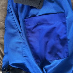 Style Adix Alterations & Custom Apparel - New blue scrub butt pocket and water resistant zippers added to big side pockets. Black scrub pants had a hole on the ankle cuff fixed.