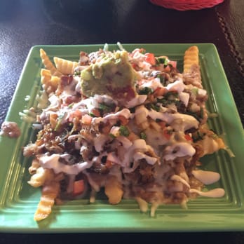 El Michoacano - This is asada nacho fries, sans asada, with carnitas. Pig makes everything better. Even things already good. - Mexican Near Me - Coalinga, California El Michoacano - This is asada nacho fries, sans asada, with carnitas. Pig makes everything better. Even things already good. - Mexican Near Me - Coalinga, California