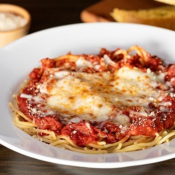 Pizza Factory - a plate of spaghetti and bread - Pizza Near Me - Cameron Park, California Pizza Factory - a plate of spaghetti and bread - Pizza Near Me - Cameron Park, California