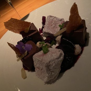 1000 NORTH - Ganache with blackberry sauce, hazelnuts, marshmallows, and fresh blackberries in a citrus tuile. - Bars Near Me - Jupiter, Florida 1000 NORTH - Ganache with blackberry sauce, hazelnuts, marshmallows, and fresh blackberries in a citrus tuile. - Bars Near Me - Jupiter, Florida