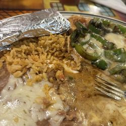 El Patio - Can't remember the name but it's poblano pepper on chicken with white cheese. Delicious