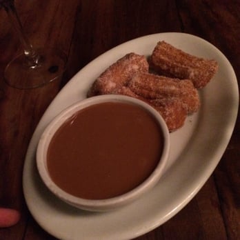 Adega Santiago - Mini churros. Delicious desert. It is a sweet dough deep fried and a dulce de leche dipping - Bars Near Me - São Paulo, SP Adega Santiago - Mini churros. Delicious desert. It is a sweet dough deep fried and a dulce de leche dipping - Bars Near Me - São Paulo, SP