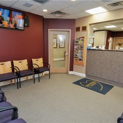 NowDental of Suffolk - Now Dental of Suffolk patient waiting room with plenty of seats and a TV.