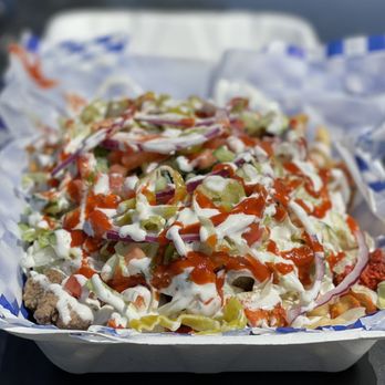 Mykonos Gyros - Mykonos Fries~ The lamb & chicken was tender & flavorful, topped with Tzatziki & hot sauce to add a nice hint of spice to the loaded fries! - Mediterranean Near Me - Sacramento, California