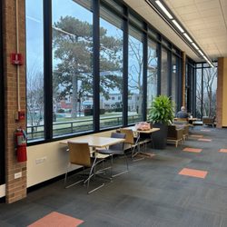 Cook Memorial Public Library District - tables with outlets next to the windows