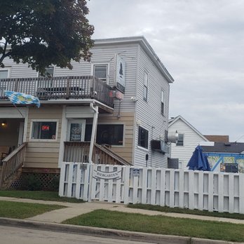 Eckbar The German Corner Bar - a white picketer fence - Bars Near Me - West Allis, Wisconsin