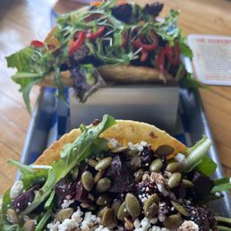 The GOAT taco - roasted beets, goats cheese , pepitas and fresh taco . The GOAT taco - roasted beets, goats cheese , pepitas and fresh taco .