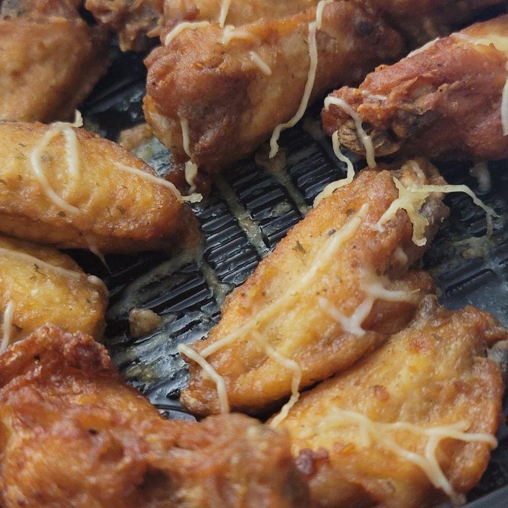 Wings Out - 16pc Garlic Parmesan 1/3 eaten - Food Delivery Services Near Me - Cary, North Carolina Wings Out - 16pc Garlic Parmesan 1/3 eaten - Food Delivery Services Near Me - Cary, North Carolina