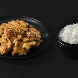 Aroi Thai - A bold Thai stir-fry featuring any of your choice protein, sautéed with fresh garlic and tossed in a rich black soy sauce. Served with steam
