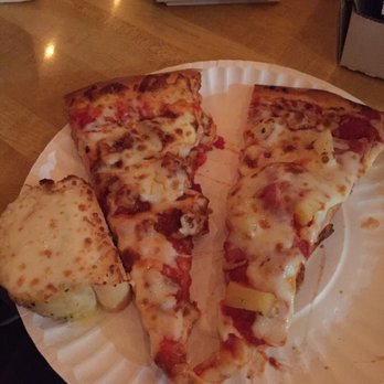 Three Weavers Brewing Co - Slices of Tumby's pizza and garlic bread. The left slice is BBQ chicken and the right is pineapple. I really liked the BBQ chicken pizza. - Breweries Near Me - Inglewood, California