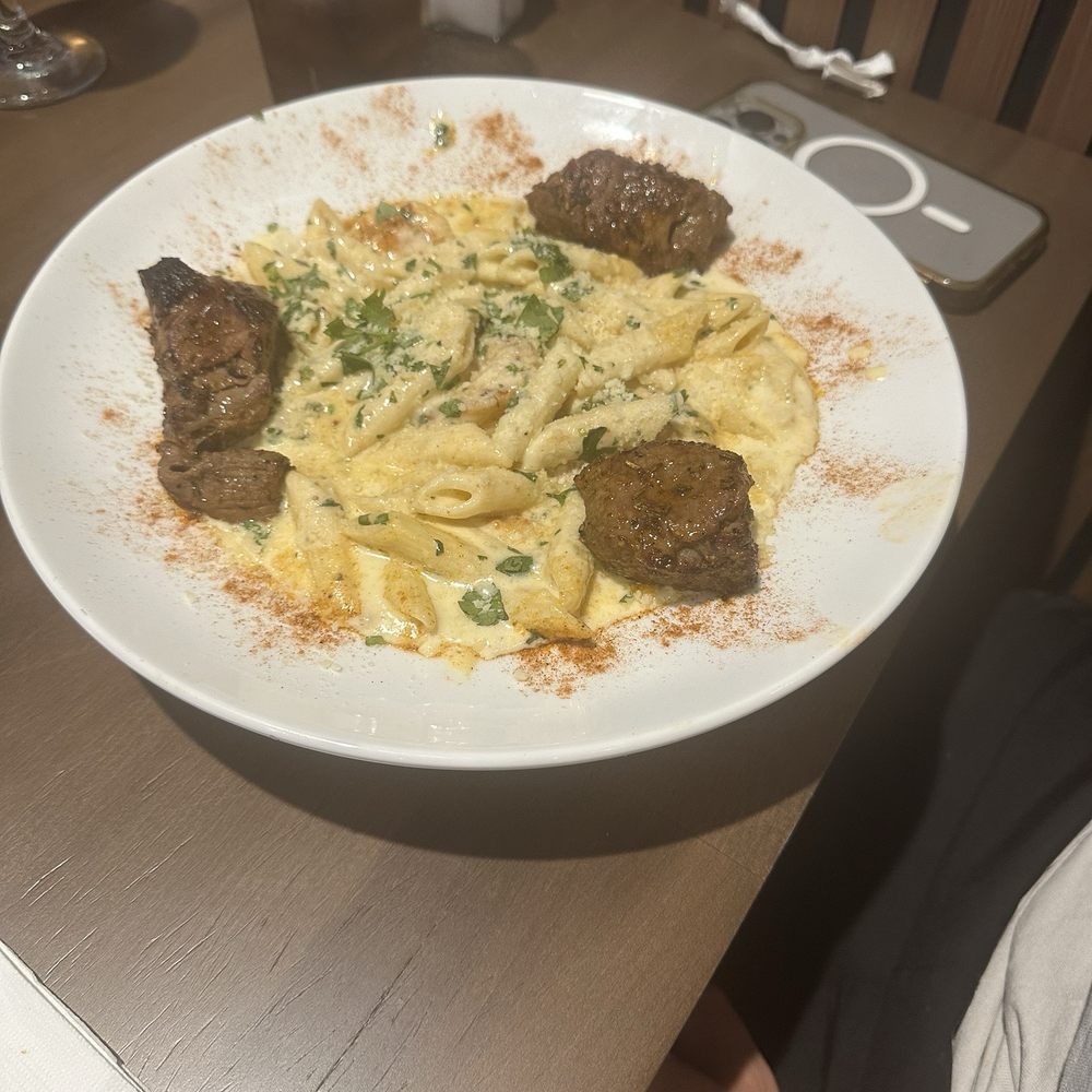 Freddy's Bar and Grill - Penne Alfredo Cajun with shrimp and add on steak - Mediterranean Near Me - Stanhope, New Jersey