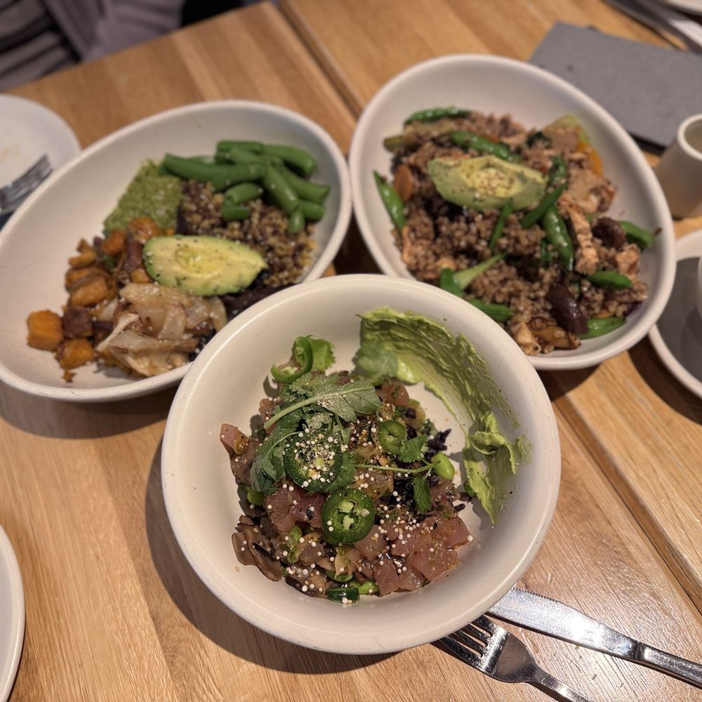 True Food Kitchen - Three bowls. Poke at the bottom; teriyaki on right; ancient grain on the left - Salad Near Me - Fairfax, Virginia True Food Kitchen - Three bowls. Poke at the bottom; teriyaki on right; ancient grain on the left - Salad Near Me - Fairfax, Virginia