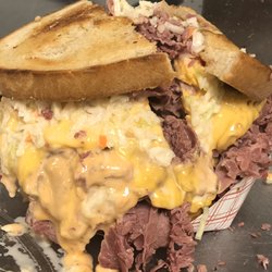 Mr. Corned Beef - WHATCHAMACALLIT WEDNESDAY! It's what we called it a MR with coleslaw,Russian dressing , mustard , cheese on rye toasted bread!