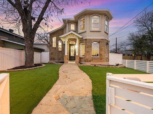 Design Build East Austin Leona St. - New Construction in the Heart of Old East Austin.  We brought water to this old lot and drew a custom home from scratch to be built around a Huge Heritage Pecan Tree. Completely custom with solid cherry hardwood, stone and marble flooring. It also featured exotic granite countertops, master masonry, and a custom wrought iron front door and transom.