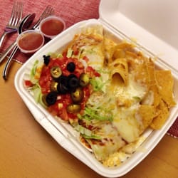 The Taco Shop 2 - Underneath the chips and tomatoes, there is in fact a smothered burrito.