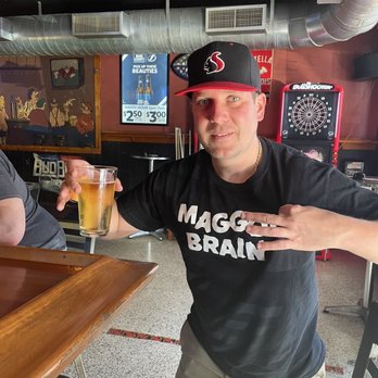 Steve's Tavern - a man holding a glass of beer - Dive Bars Near Me - St. Petersburg, Florida