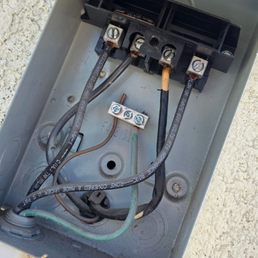 a melted part in AC that this technician found caused by a different company.