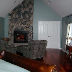 Eco Chic Interiors - Romance is alive in this tranquil and cozy bedroom. Wood, fabric and stone add texture and life.