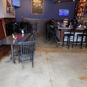 Blue Moon Pizza - tables and chairs in a restaurant - Pizza Near Me - Atlanta, Georgia Blue Moon Pizza - tables and chairs in a restaurant - Pizza Near Me - Atlanta, Georgia