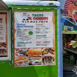 Tacos El Gordis - Menu board. All entrees are $12 with one meat, price goes up for multiple. Nachos are $9